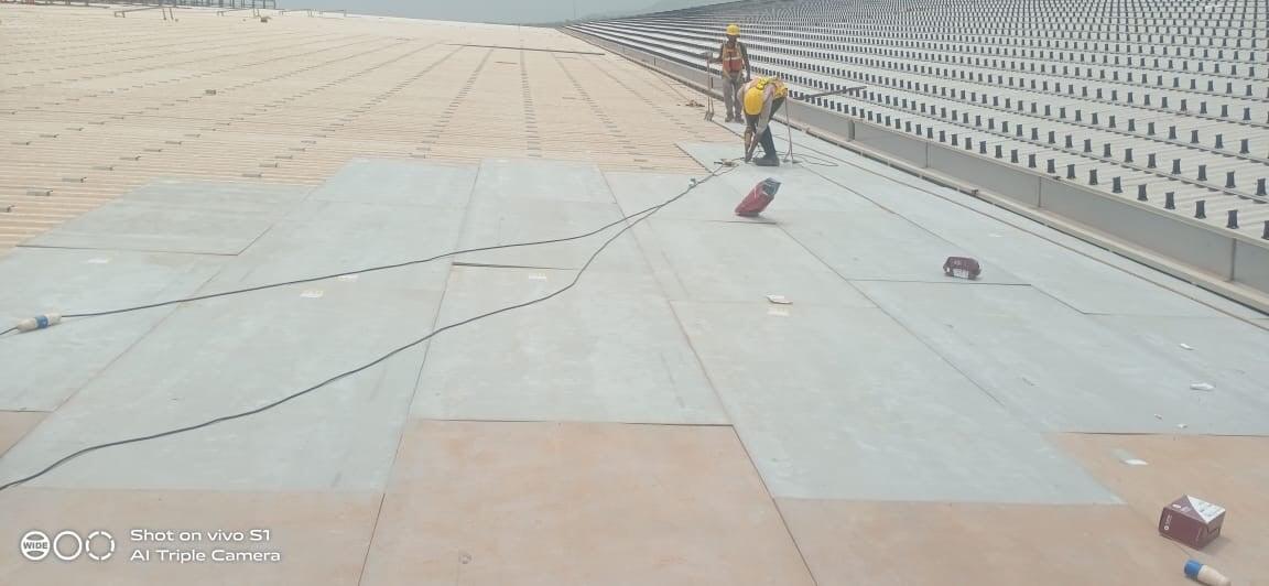 Architectural standing seam roofing for Lodha Mumbai: Premium metal building envelope featuring a minimalist aesthetic and hidden fastener technology by Rishonn & Reyansh.